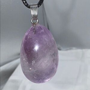 amethyst light purple and clear 1.5” pendant on a 9” cord